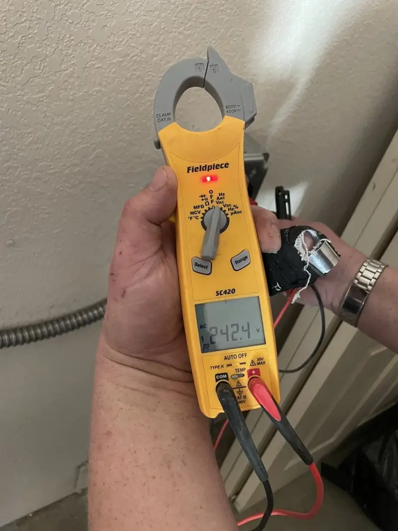 Voltage testing with clamp meter during Generator Installation in Almena